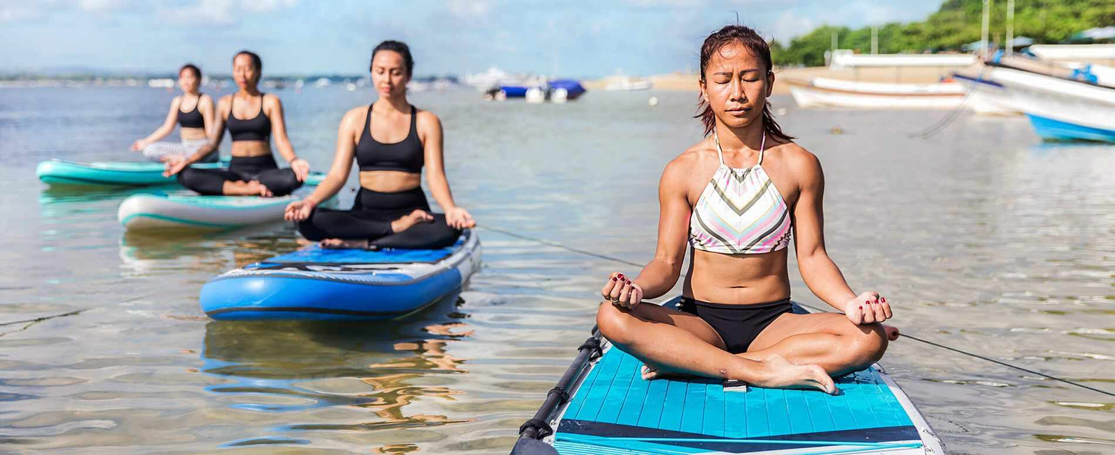 Why Stand Up Paddle Board Yoga Is The Best Summer Workout - Camille Styles